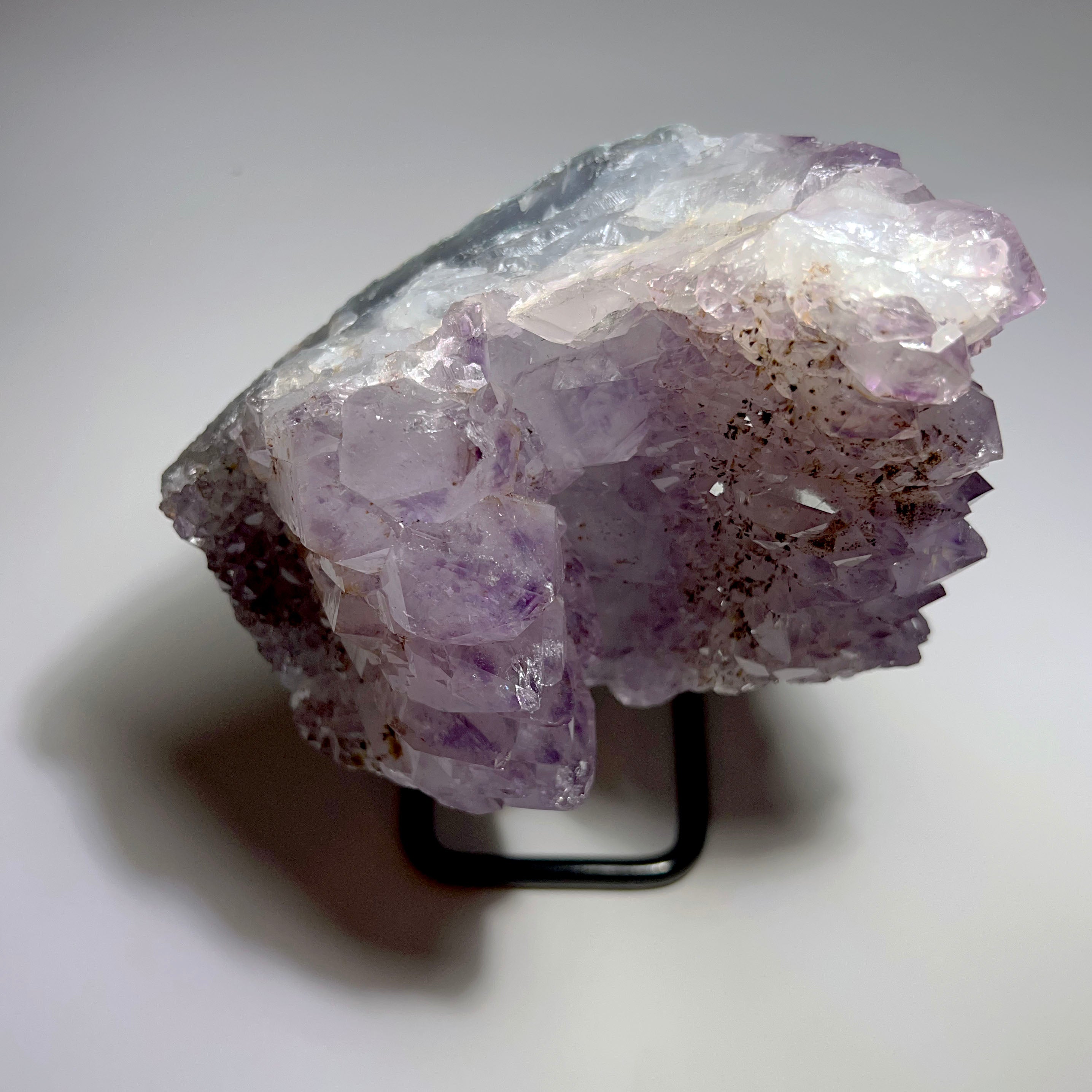 Amethyst with Goethite on stand